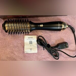 Nexpure hot air 4 in 1 Dryer/hair styler in black. NEW in box straighten, curl.